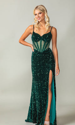 A woman models the Dancing Queen 4360 Lace-Up Long Sequin Prom Dress—an affordable green gown with thin straps, a beaded sheer corset-style bodice, and a thigh-high slit—against a plain light background.