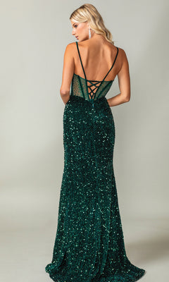 A woman models the affordable Dancing Queen 4360 lace-up long sequin prom dress in emerald green, featuring thin straps and a shimmering finish, as she glances over her shoulder.