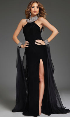 A woman wearing the Jovani 43696 long black formal dress, featuring a high slit, beaded neckline, and matching cuffs, stands against a plain gray background.