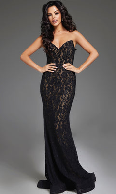 A woman poses gracefully against a plain gray background wearing the Jovani 43760 Long Lace Prom Dress, featuring a strapless design and sweetheart neckline.
