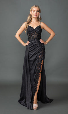 A woman stands against a plain background wearing the Draped Long Glitter Prom Dress: Dancing Queen 4377 in black, featuring a corset-style bodice, lace details, a thigh-high slit, and silver high-heeled sandals.