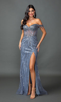 A woman poses against a plain gray background in the Dusty Blue Fringe-Strapped Long Sequin Prom Dress 4385, featuring sparkling sequins, off-the-shoulder fringe straps, and a thigh-high slit.