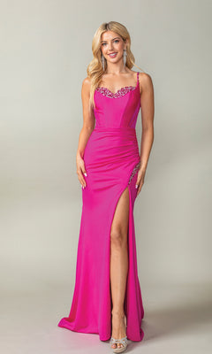 A woman models the Long Ruched Glitter Prom Dress (Dancing Queen 4388), featuring bright pink beads, thin straps, an embellished neckline, a thigh-high slit, and silver heels against a plain light backdrop.