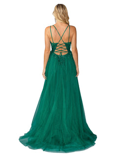 A woman faces away from the camera in the Long Prom Dress 4393 by Dancing Queen, featuring green tulle, an a-line silhouette, thin straps, and a lace-up back.