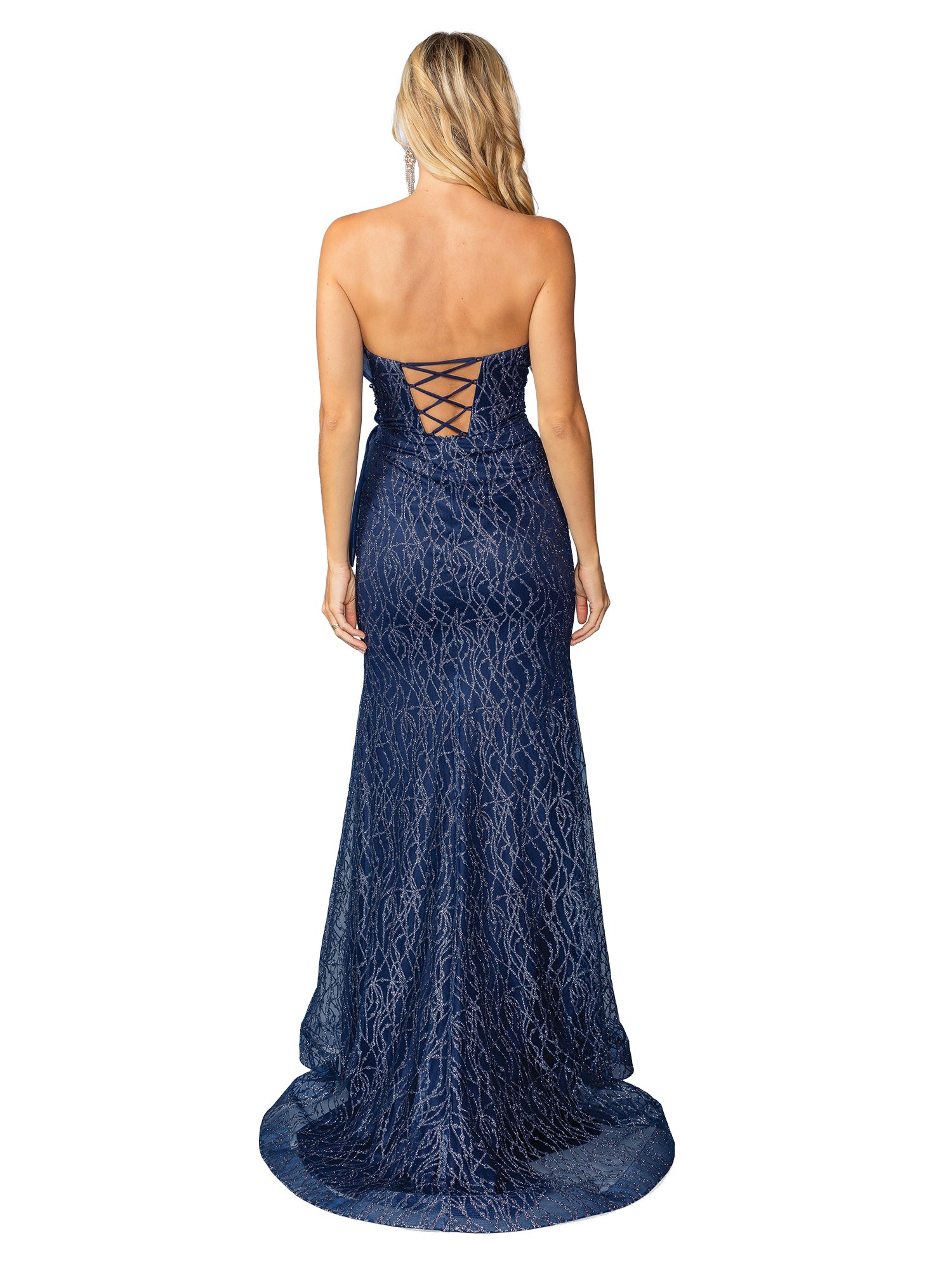A woman wearing the Side-Bow Strapless Long Glitter Prom Dress 4394, a floor-length navy gown with a lace-up back, stands facing away from the camera.