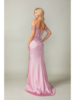 A woman models the Off-the-Shoulder Long Prom Dress 4401 with beaded sleeves in pink satin, standing and looking over her shoulder against a plain backdrop.