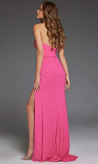 Woman wearing the Jovani 44066 Strapless Sweetheart Long Prom Gown with a side slit, styled with long wavy hair and clear high heels, poses against a plain gray background.