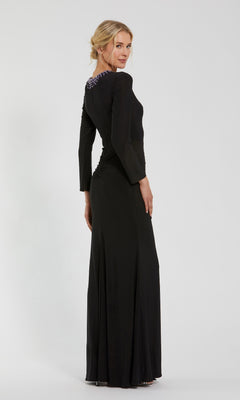 Woman standing backward, wearing the Mac Duggal 44069 Bead-Neckline Long Formal Dress with modest long sleeves and beaded shoulder detail, set against a plain light background.
