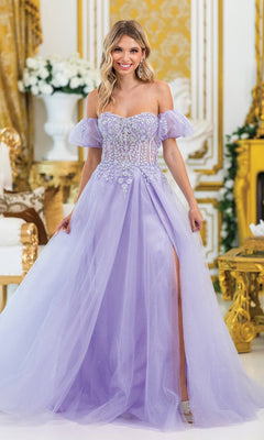A woman wearing the Strapless Sweetheart Long Prom Dress 4406—a lavender A-line gown with a sheer embroidered bodice, floral accents, and high slit—stands in an ornate gold-and-white room.