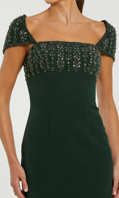 Dark green dress with beaded shoulder details on a white background