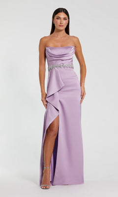 A woman in the lilac Mac Duggal 44133 long formal dress, featuring a strapless satin design with an embellished belt, draped front, thigh-high slit, and silver heels stands against a plain background.