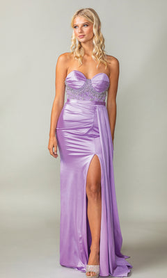 A woman models the Strapless Long Sash Prom Dress: Dancing Queen 4414 in lilac with a sheer embellished beaded bodice and thigh-high slit, standing against a plain background.