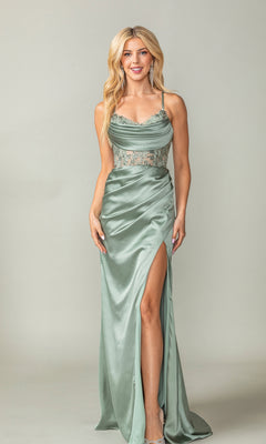 A woman poses against a plain background in the Sheer-Waist Long Prom Dress: Dancing Queen 4416, featuring light green satin fabric with lace bodice detail and a high slit on the skirt.
