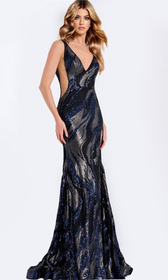 A woman wears the Jovani 44170 long prom dress in navy—a sleeveless, fitted gown with a deep V-neckline and shimmering sequined wave patterns.
