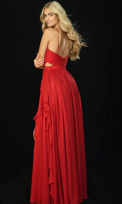 A woman with long blonde hair models the sleeveless, backless Jovani 44233 long prom dress in red with ruffle detail, standing against a black background and looking over her shoulder.
