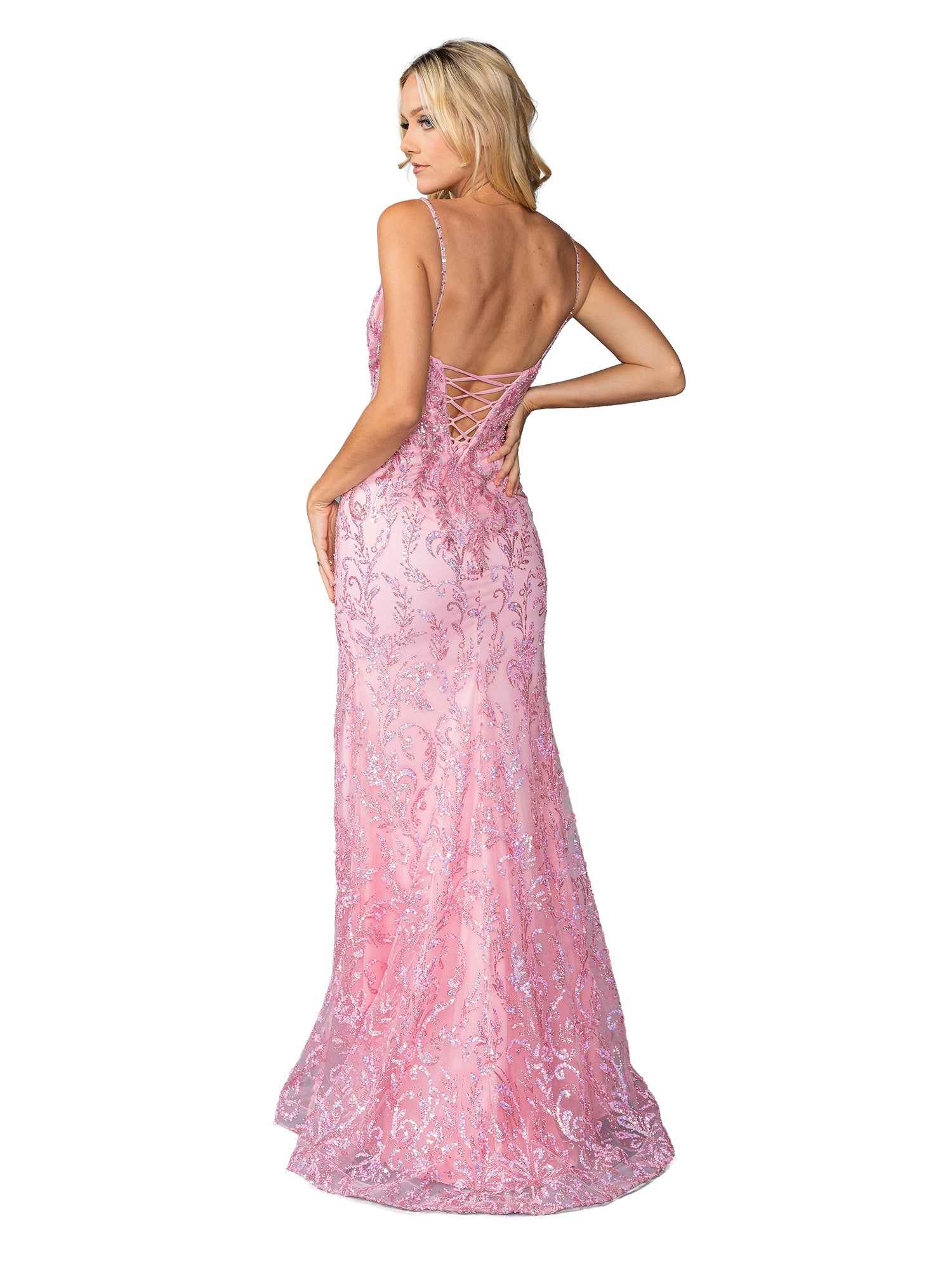 A woman models the Dancing Queen 4426, a sleeveless, floor-length sequin-print prom dress in light pink with an open lace-up back, posing against a white background.