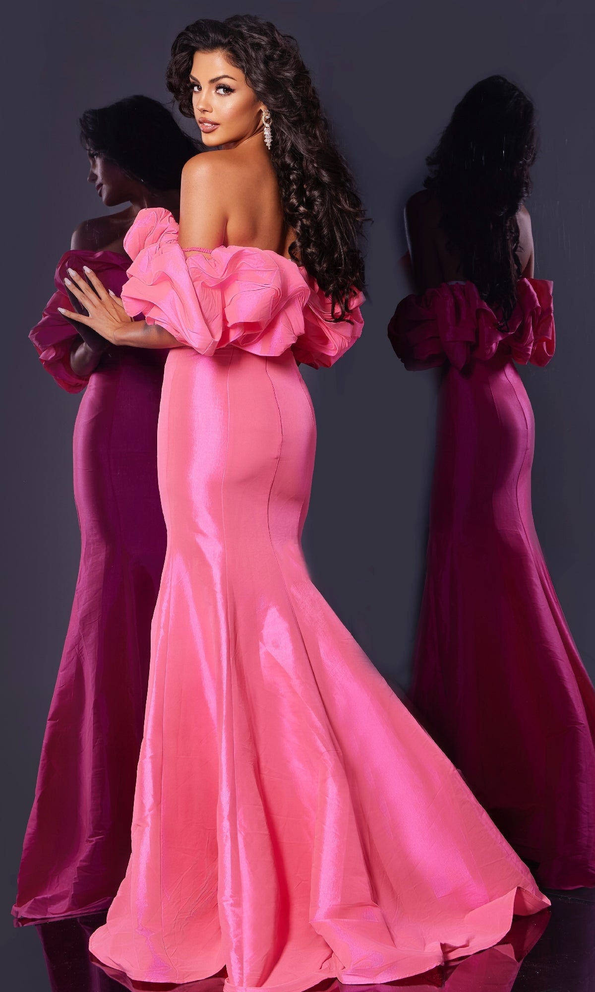 Woman wearing the Long Prom Dress: Jovani 44271, a fitted ruffled off-the-shoulder pink mermaid gown, poses by a mirror to highlight the elegant back and side views.