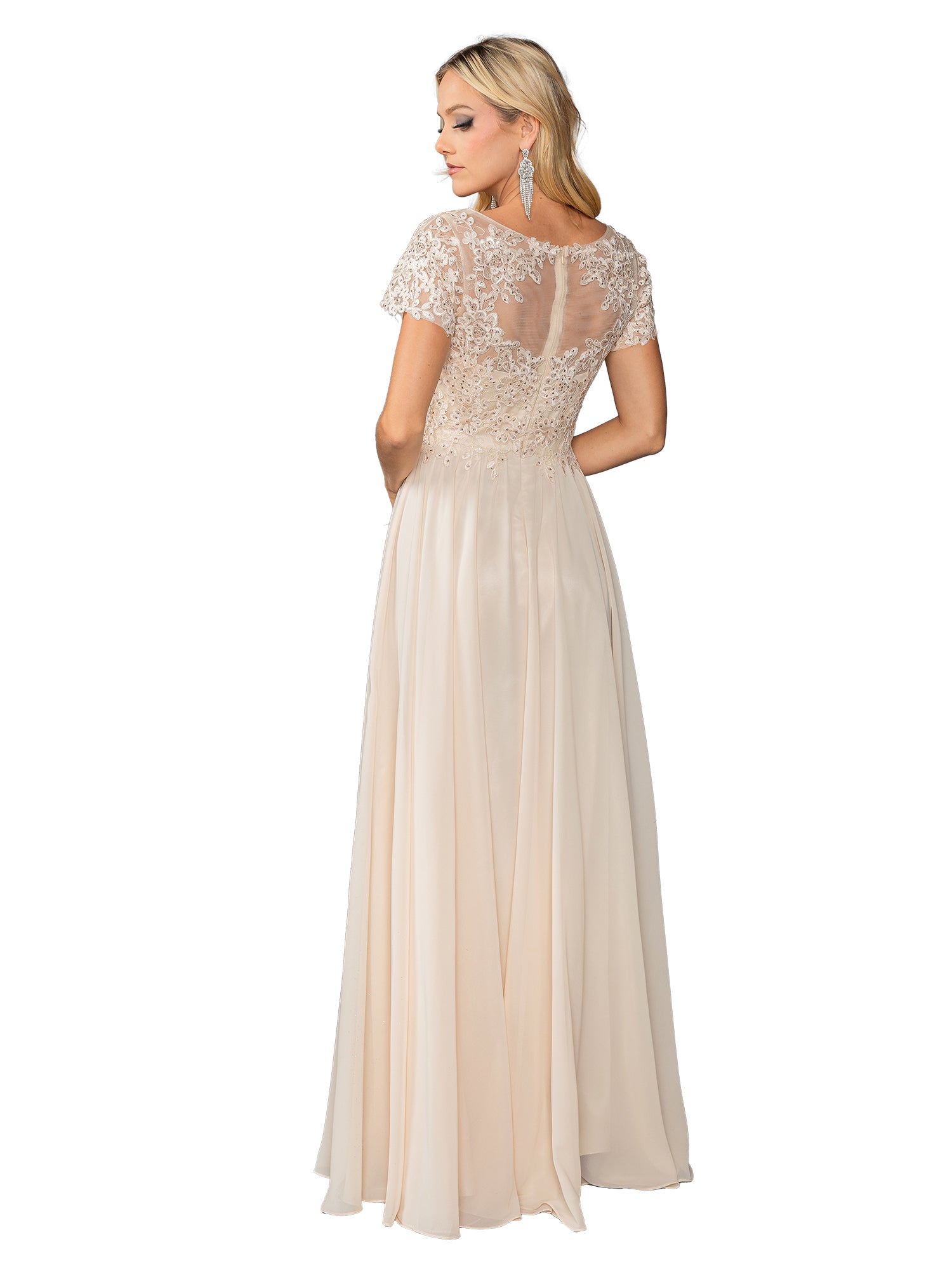 A woman stands looking over her shoulder in the Dancing Queen 4433 Short Sleeve Long Prom Dress, featuring a floor-length light beige design with lace bodice detailing and a sheer back.