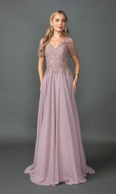 A woman poses against a gray background in a mauve Dancing Queen 4445 long formal dress, featuring short sheer lace sleeves and a fitted embroidered-lace bodice.
