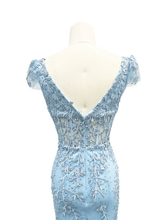 Back view of the Cap-Sleeve Long Prom Dress: Dancing Queen 4447, featuring light blue beaded lace, floral embroidery, sheer fabric, and a deep V-back design.
