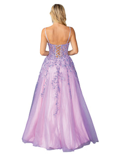 A woman with blonde hair is shown from behind wearing the Long Glitter Prom Ball Gown: Dancing Queen 4452, a lavender A-line formal dress with thin straps, a lace-up open back, and floral embellishments.