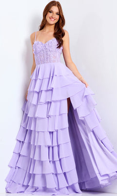 A woman in the Jovani 44543 lilac long prom dress with a lace corset bodice, sheer straps, and tiered ruffle chiffon skirt stands against a white background.