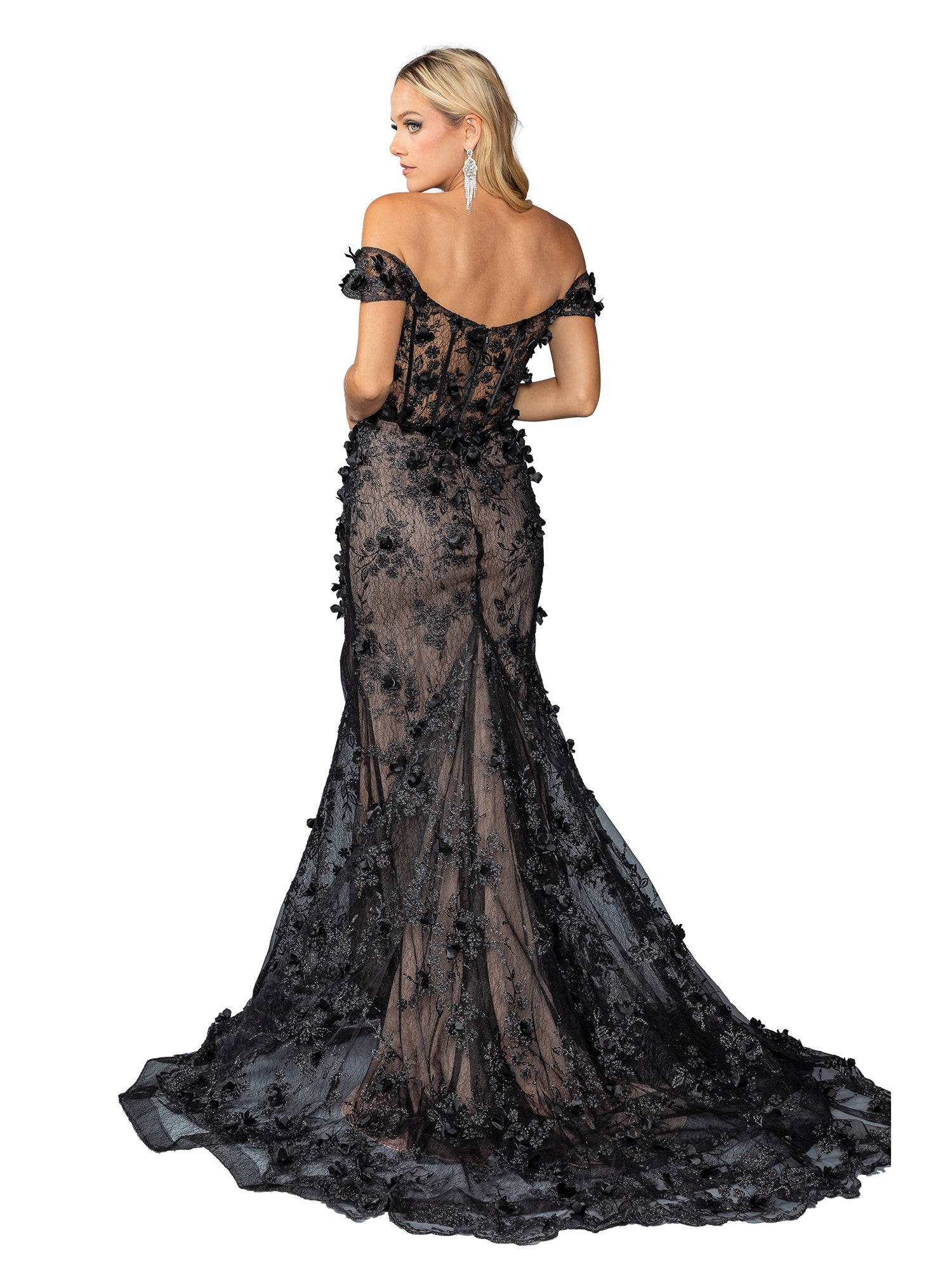 A woman poses with her back to the camera in the Long Black and Nude Prom Dress: Dancing Queen 4457, a floor-length off-the-shoulder gown featuring sheer lace and elegant floral appliqué.