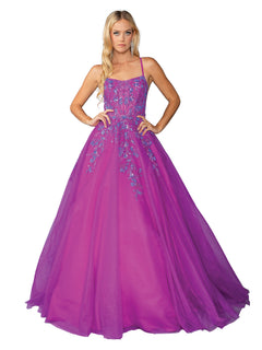 A woman wears the Long Magenta Prom Ball Gown: Dancing Queen 4460—a floor-length, sleeveless magenta dress with blue floral embroidery on the bodice and tulle skirt.