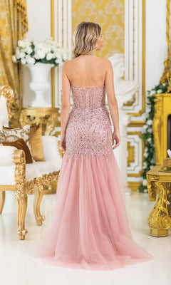 A woman in a Sequin-Bodice Long Prom Dress (Dancing Queen 4468) stands with her back to the camera in an ornate, gold-decorated room, her shimmering gown catching the light elegantly.