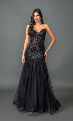 A woman stands against a gray background wearing the Sequin-Bodice Long Prom Dress: Dancing Queen 4468 in black, featuring a sheer bodice and elegant mermaid silhouette—a stunning and affordable formal choice.