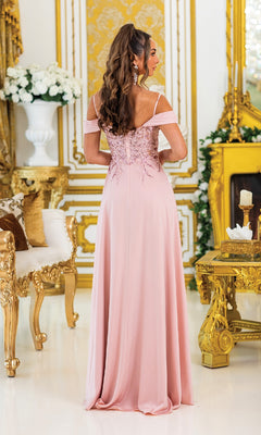 A woman in the Lace-Corset Long Prom Dress: Dancing Queen 4474 stands facing away in an ornate room with gold and white décor.