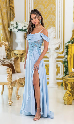Woman wearing the Lace-Corset Long Prom Dress: Dancing Queen 4474 in light blue, featuring an off-the-shoulder neckline and high slit, stands in an ornate gold-accented room with elegant white and gold furniture and floral arrangements.