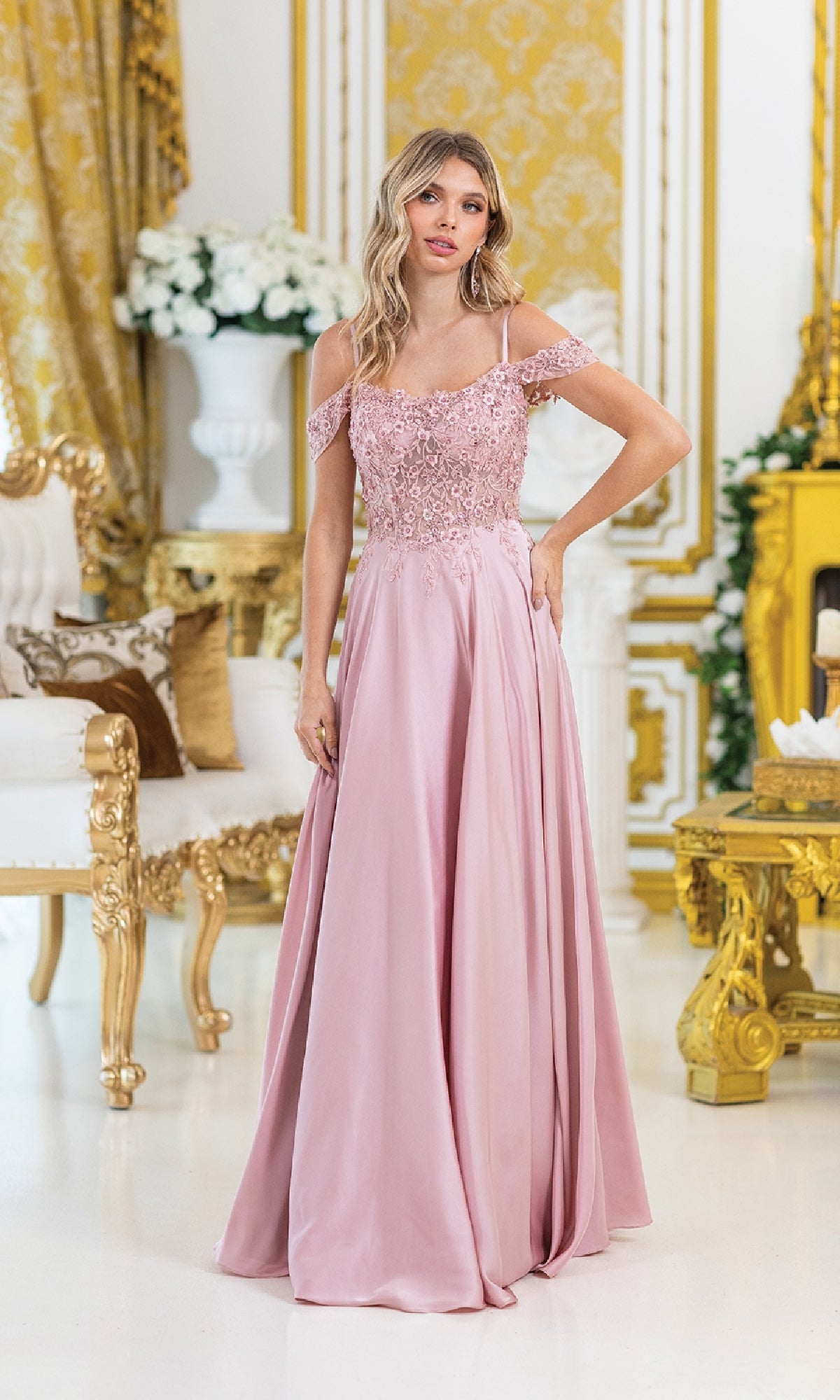 A woman in a pink Lace-Up Long A-Line Prom Dress, Dancing Queen 4482, stands in an ornate room with gold accents, white furniture, and floral decorations.