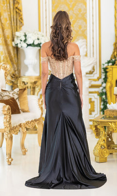 A woman with long wavy hair faces away in an ornate room, wearing the Sequin-Bodice Long Prom Dress: Dancing Queen 4486 with a beaded bodice and elegant off-the-shoulder sleeves.