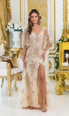 A woman in the Dancing Queen 4493 Prom Gown with removable sleeves and a thigh-high slit stands in an ornate room decorated with gold accents and white flowers.