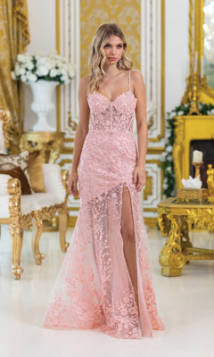 Wearing the Beaded-Floral Long Prom Dress: Dancing Queen 4501 in light pink, a woman stands in an ornate room adorned with gold accents and beaded flowers.