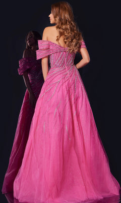 A woman with long, wavy hair wears Jovani 45067, a long prom dress with beaded embellishments and an elegant A-line skirt, standing with her back to the camera beside her reflection in a mirror.