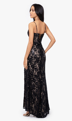 Woman wearing the Sequin-Lace Long Lace-Up Prom Dress 4521BN, a black junior evening gown with sequins and spaghetti straps, shown from the back against a plain white background.