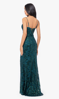 A woman models the Sequin-Lace Long Lace-Up Prom Dress 4521BN in dark green with thin straps and a low back, standing against a plain white background.