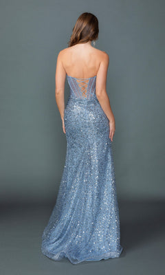 Woman wearing the Strapless Long Blue Prom Dress: Dancing Queen 4534, featuring a lace-up back and sparkling sequin details, stands against a plain grey background facing away from the camera.