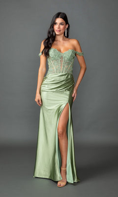Wearing the Dancing Queen 4536, a light green, off-shoulder, floor-length prom dress with lace bodice, sheer paneling, and thigh-high slit, a woman poses against a plain gray background.