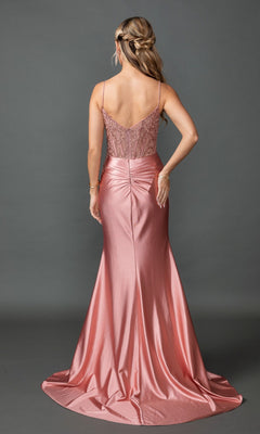 A woman stands facing away, wearing the Sheer-Corset Long Prom Dress: Dancing Queen 4537—an elegant, floor-length pink satin gown featuring thin straps and a fitted, embroidered-lace sweetheart bodice.