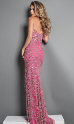 A blonde woman wearing the Jovani 45434 long formal dress poses against a plain grey background, looking back over her shoulder. The floor-length, strapless beaded sheath gown in elegant pink highlights her graceful silhouette.