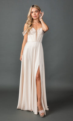 A woman wears the Dancing Queen 4544 long prom dress, a light beige, off-the-shoulder gown with a thigh-high slit and lace-up back, standing against a plain gray background.