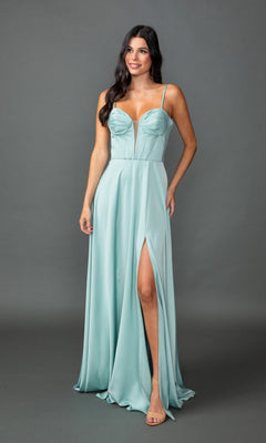 A woman stands against a plain gray background wearing the Dancing Queen 4544, a light blue long prom dress featuring an a-line silhouette, spaghetti straps, sweetheart neckline, and high slit.