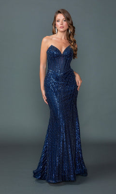 A woman in a navy Long Prom Dress: Dancing Queen 4606 with a strapless sequin bodice and flared skirt stands against a plain gray background.