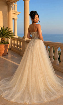A woman in the Long Prom Dress: Dancing Queen 4607 with a glitter tulle overskirt stands on a sunlit terrace, the sea and grand columned architecture behind her.