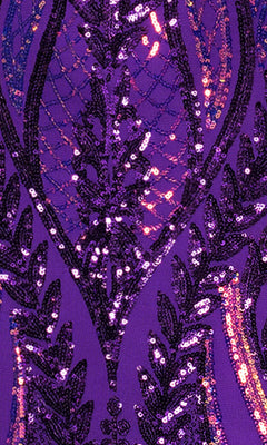 Close-up of a purple fabric with black and purple sequin embroidery, echoing the detailed patterns on the Blondie Nites 4610BN Long Sequin-Print Prom Dress.