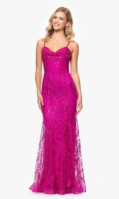 A woman models the Blondie Nites 4623BN Long Glitter Prom Dress, featuring bright pink sequins, spaghetti straps, and a fitted bodice. This elegant, sparkly evening gown stands out against a plain white background.