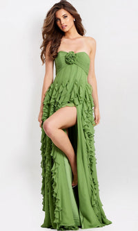Woman wearing the Jovani 46379 long prom dress, featuring a strapless green ruffled gown with a ruched bodice and high front slit, standing against a plain light background.